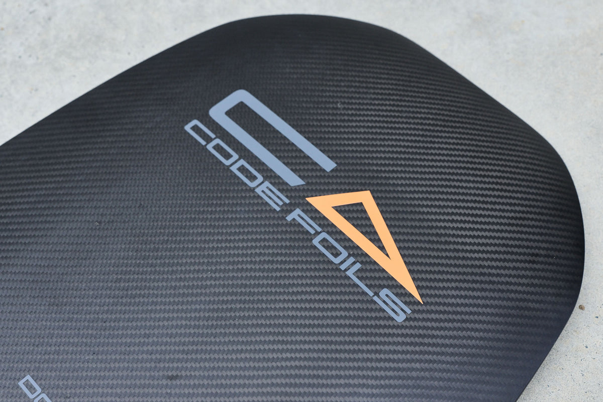 Carbon weave and Code Foils logo on the Kanga board underside