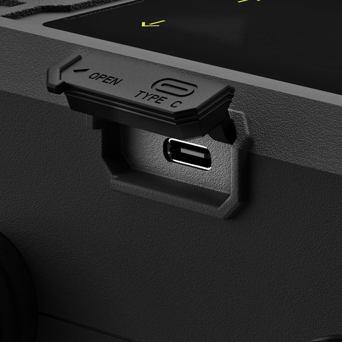 Close-up detail of USB-C charging socket on Ride Engine Air Box Mini with flap open