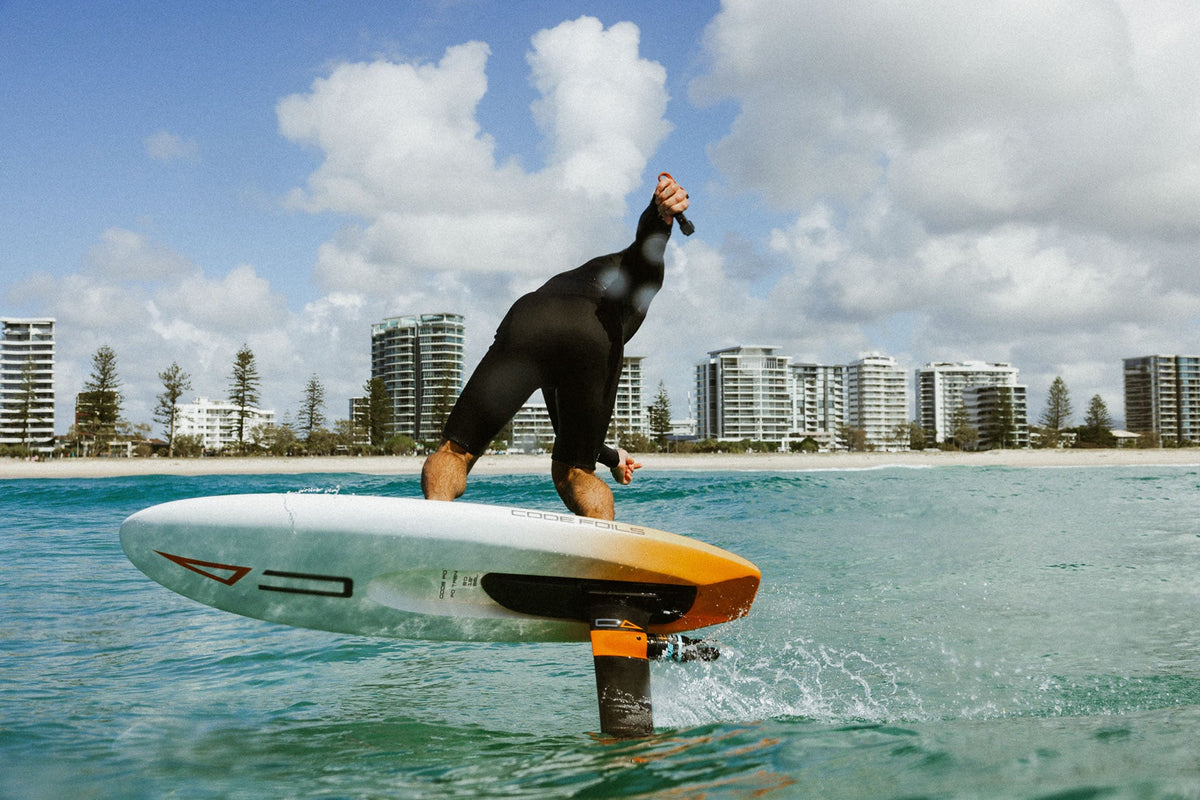 Rider foiling on a Code Foils FAST board, one of the new Code Foils board range launched in October 2026