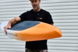 Orange tail of the Downwind SUP board held towards the camera