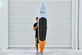 Code Foils Downwind SUP board held vertically with the deck facing forward