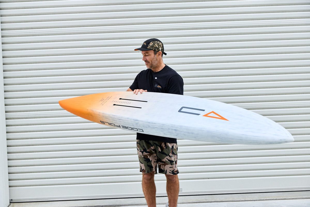 Code Foils Downwind SUP board held horizontally with the underside visible