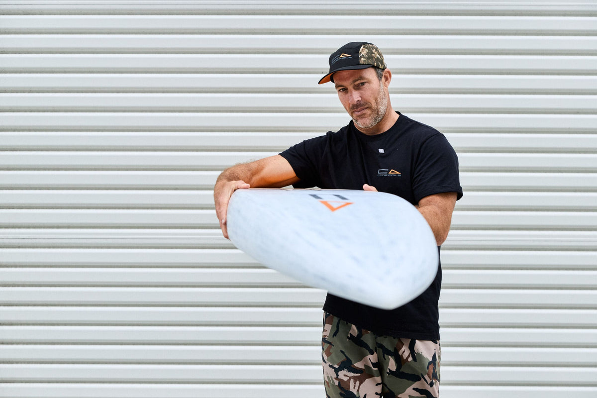 Rounded nose profile of the Code Foils Downwind SUP board held towards the camera