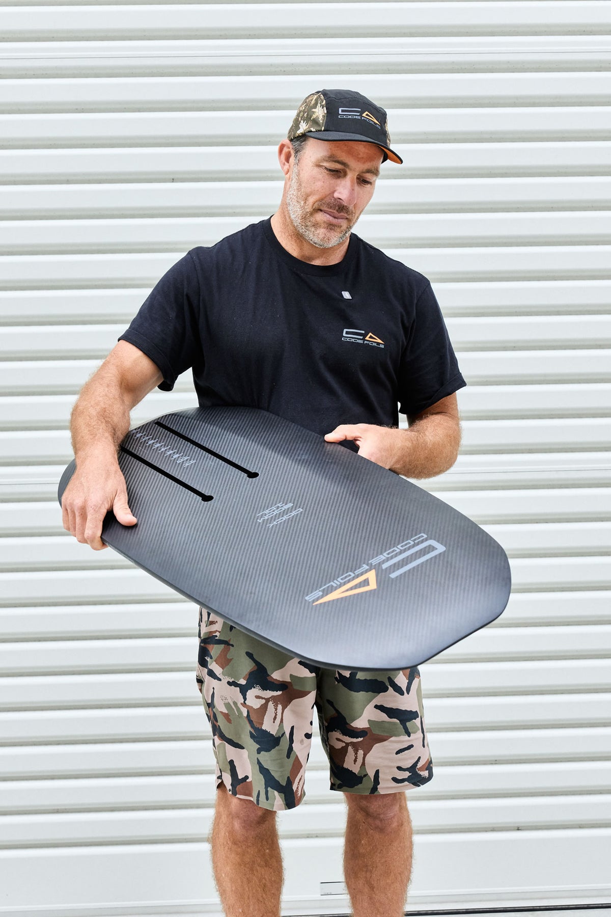 Code Foils Kanga dock-start board held with its carbon underside facing forward