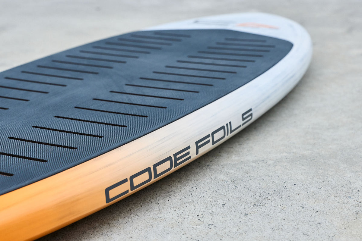 Code Foils branding along the Prone board rail beside the deck pad