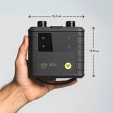 Ride Engine Air Box Mini electric pump in a hand showing compact size for kit bags and travel